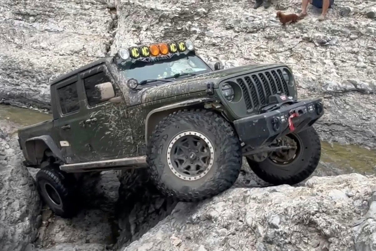 Green Jeep Gladiator JT rock crawling